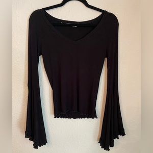 Black bell sleeve top.
